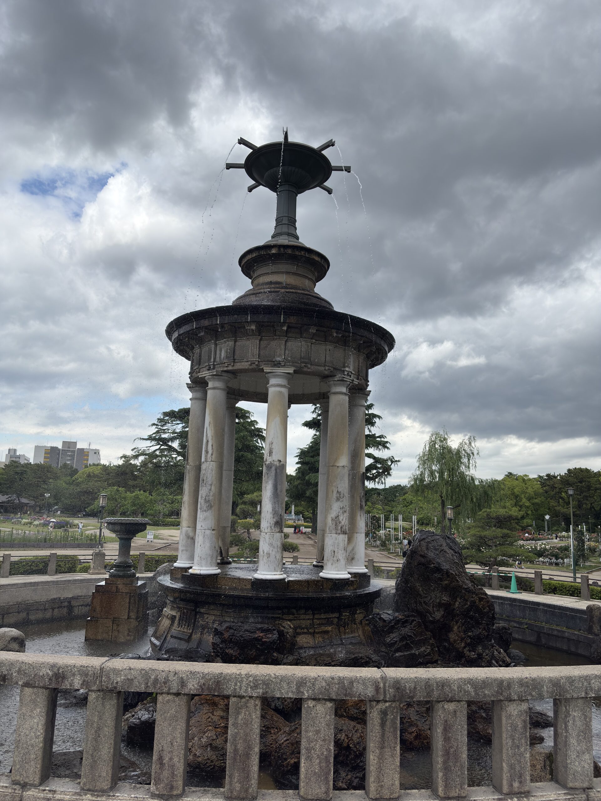 A tower with waterfalls in the park captured in daylight with the iPhone 16 48MP camera