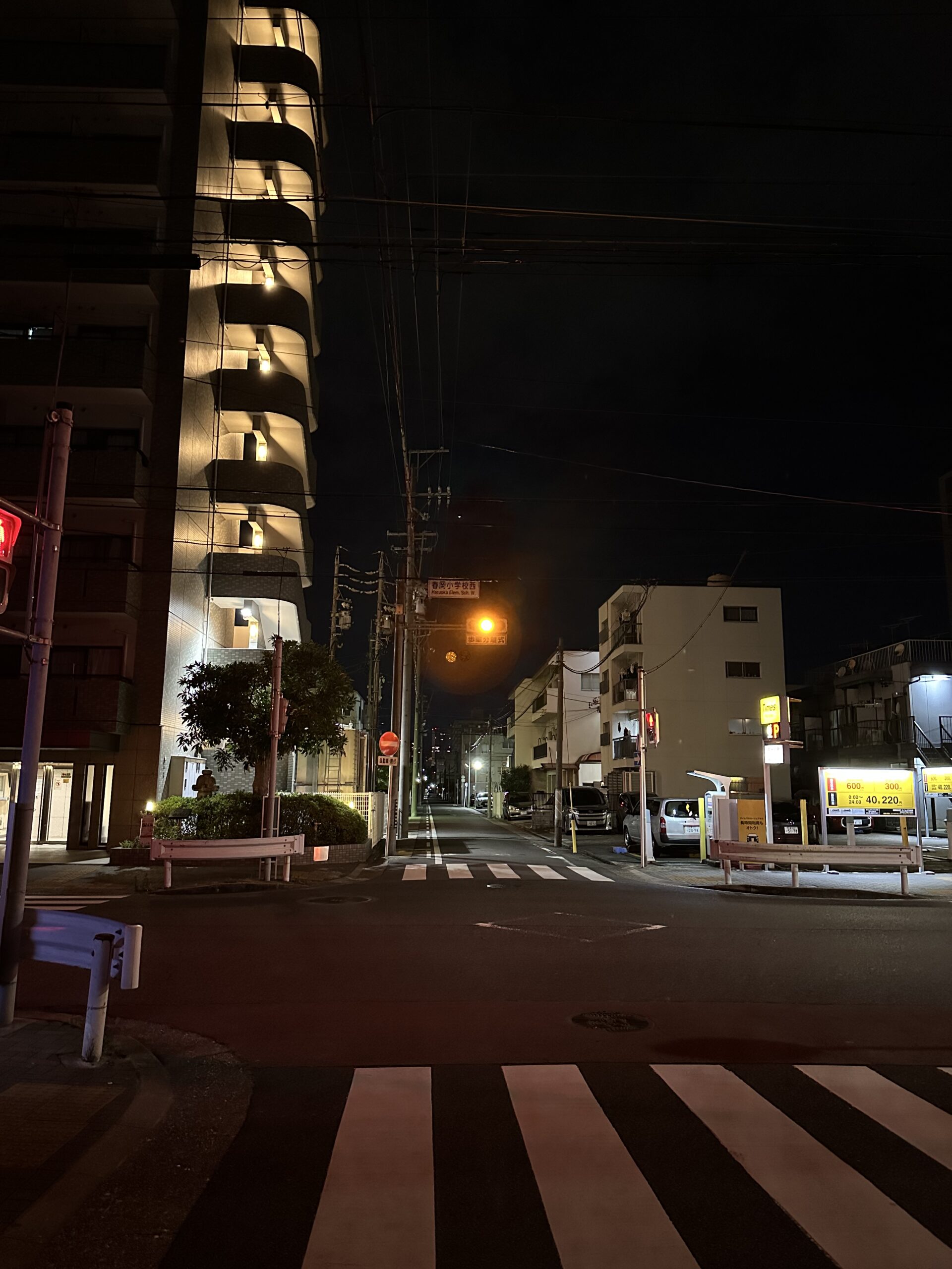 Night street scene captured with the iPhone 14 Pro Max 12MP camera showing low-light details