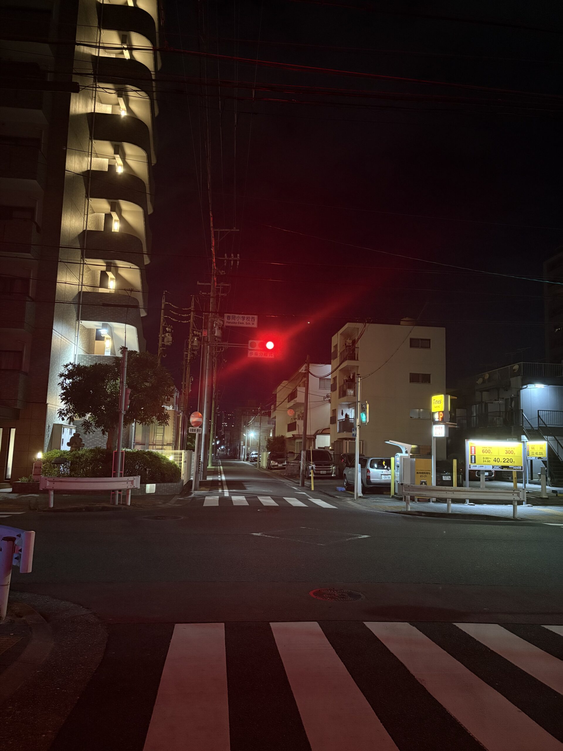 Night street scene captured with the iPhone 16 24MP main camera showing low-light details
